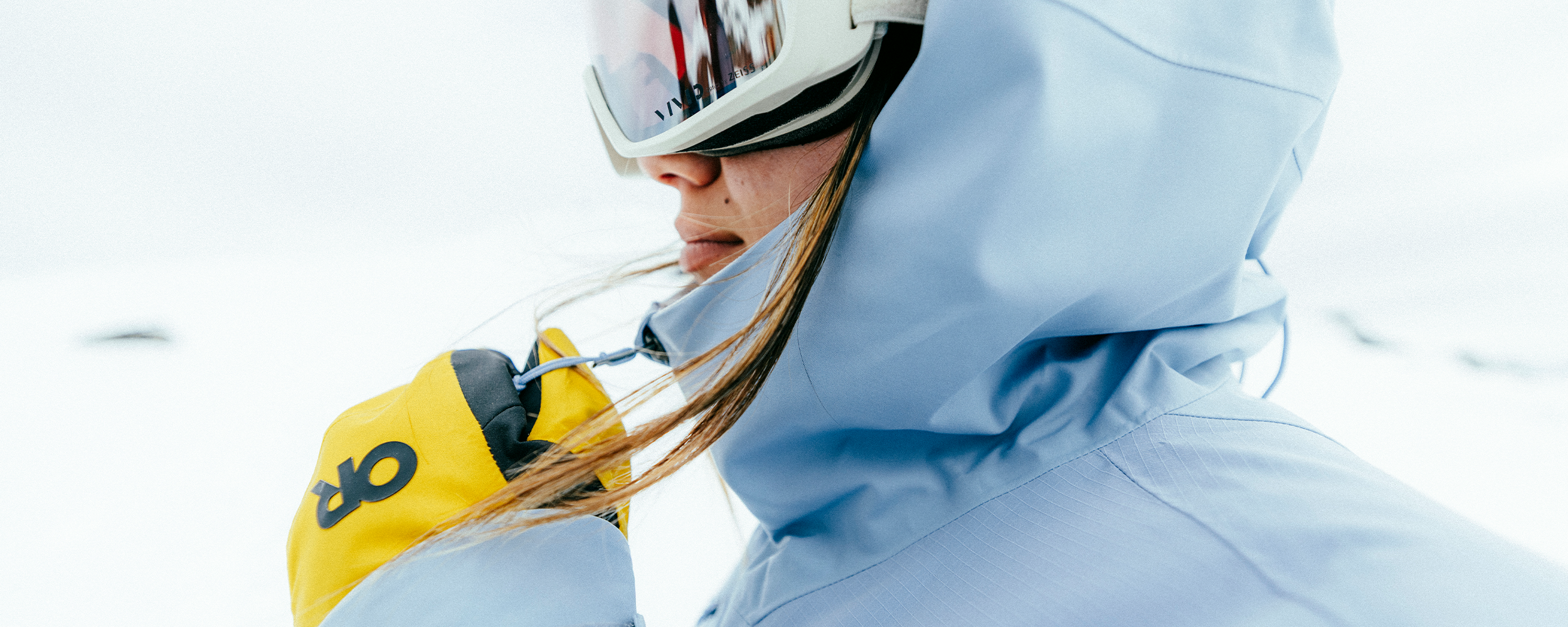 Female wearing Outdoor Research Women's Powderverse Jacket Fjord and Hemispheres Team GORE-TEX 3L Mitt. 