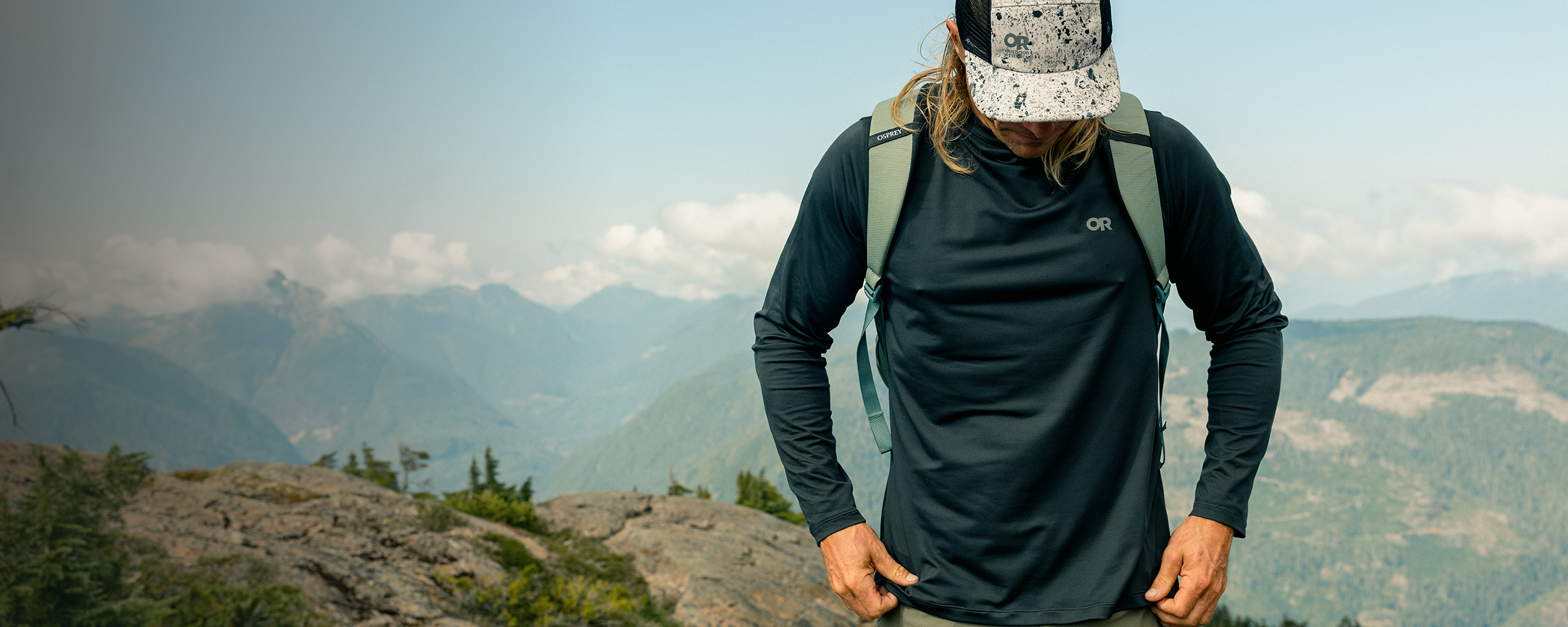 Man wearing Outdoor Research Echo Hoodie. 