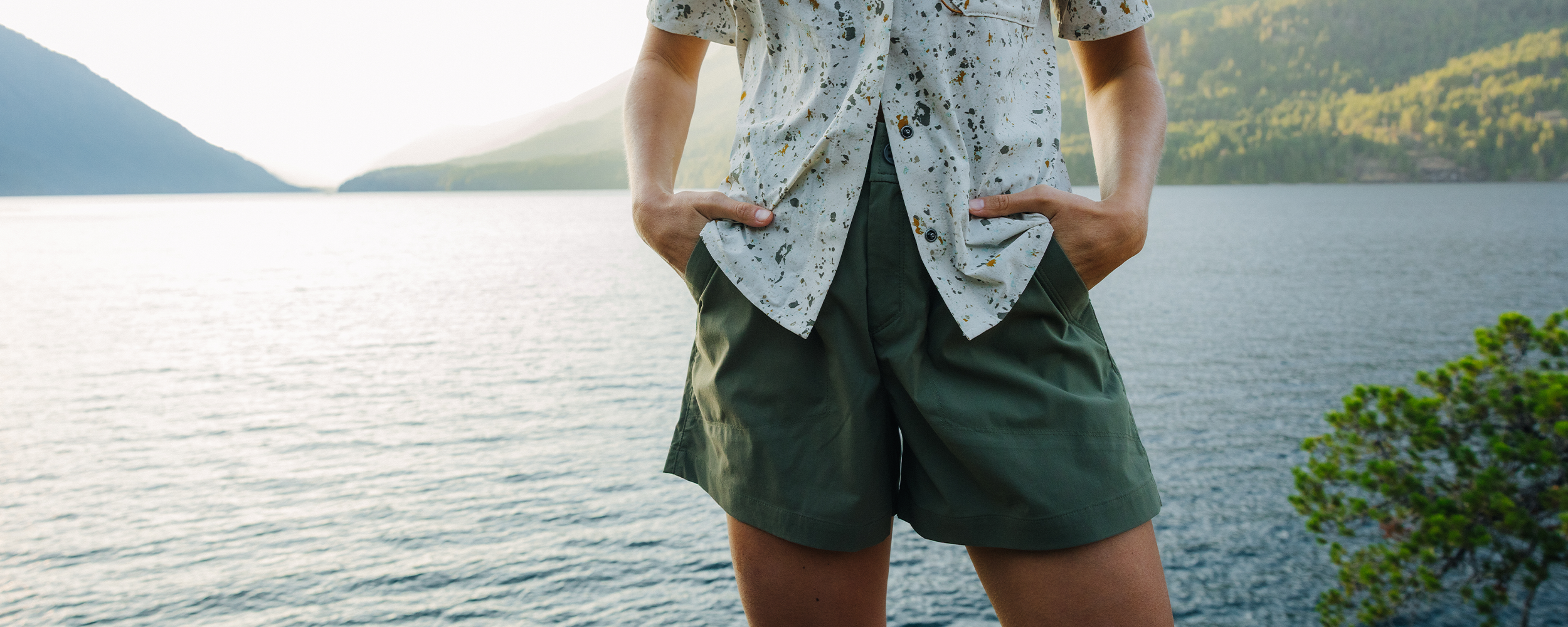 A woman puts her hand in the pocket of her Outdoor Research shorts.
