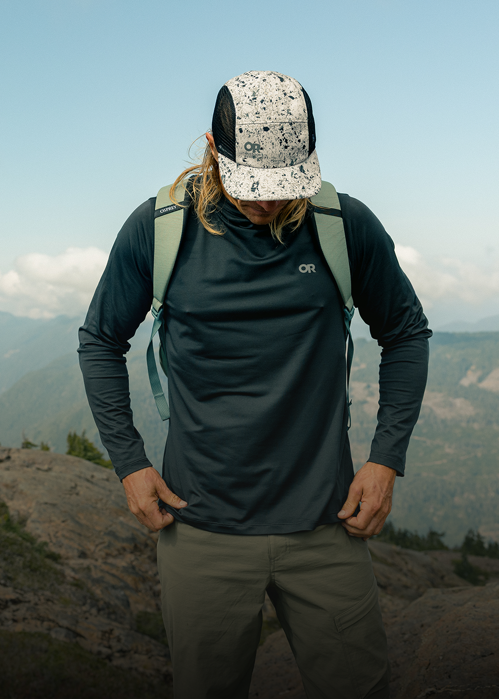 Man wearing Outdoor Research Echo Hoodie. 
